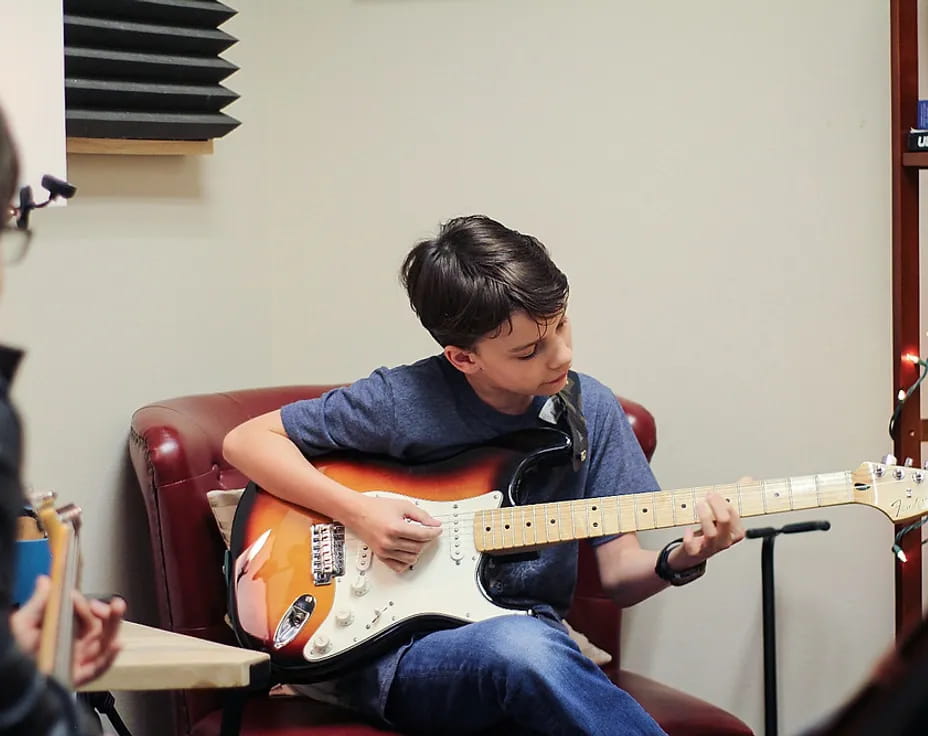 a person playing a guitar