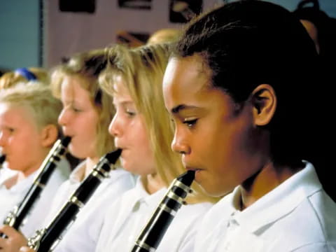a group of people in white shirts