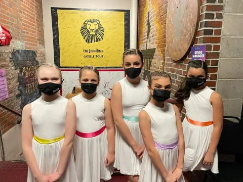 a group of women wearing masks