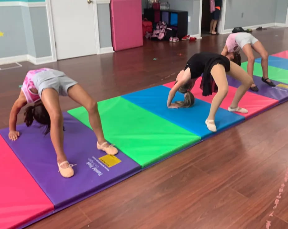 a group of women doing yoga