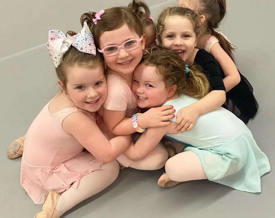 a group of girls posing for a photo