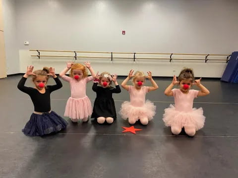 a group of girls wearing clothing