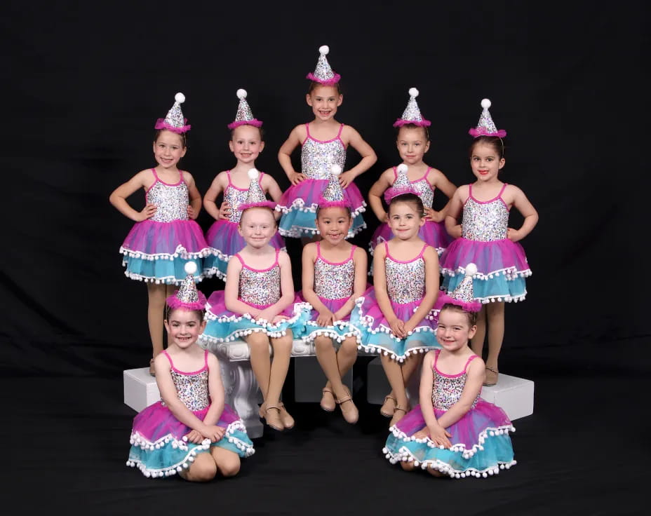 a group of girls wearing party hats