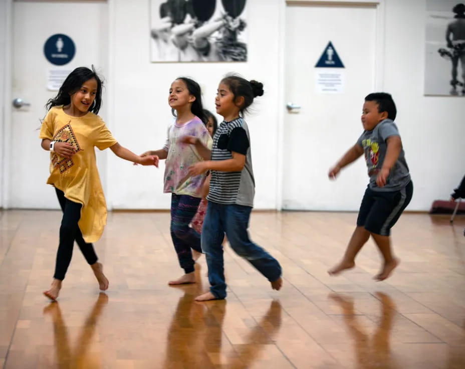 a group of children dancing