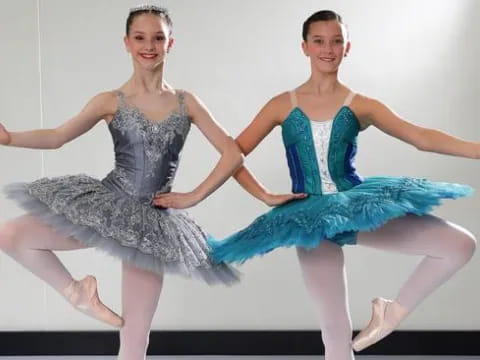 two women dancing on a stage