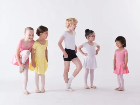 a group of children in dresses