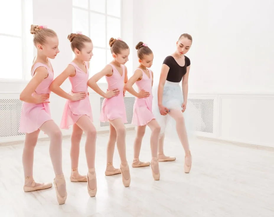a group of girls in dresses