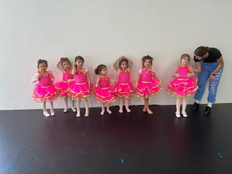 a group of girls in dresses