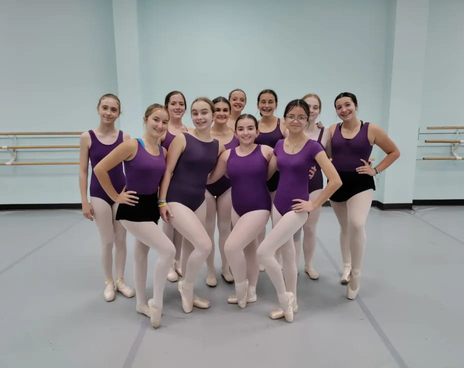 a group of women posing for a photo