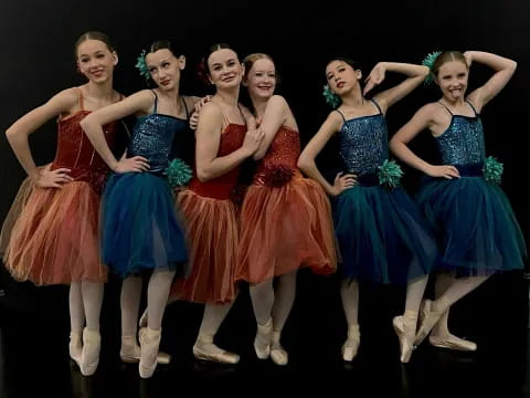 a group of women in dresses
