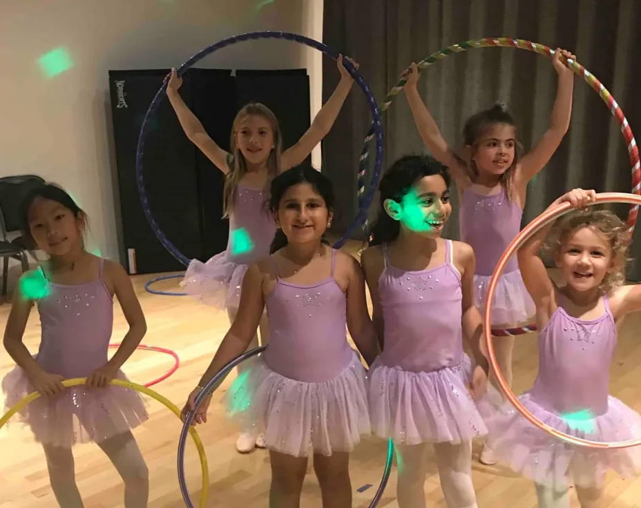 a group of girls in dresses