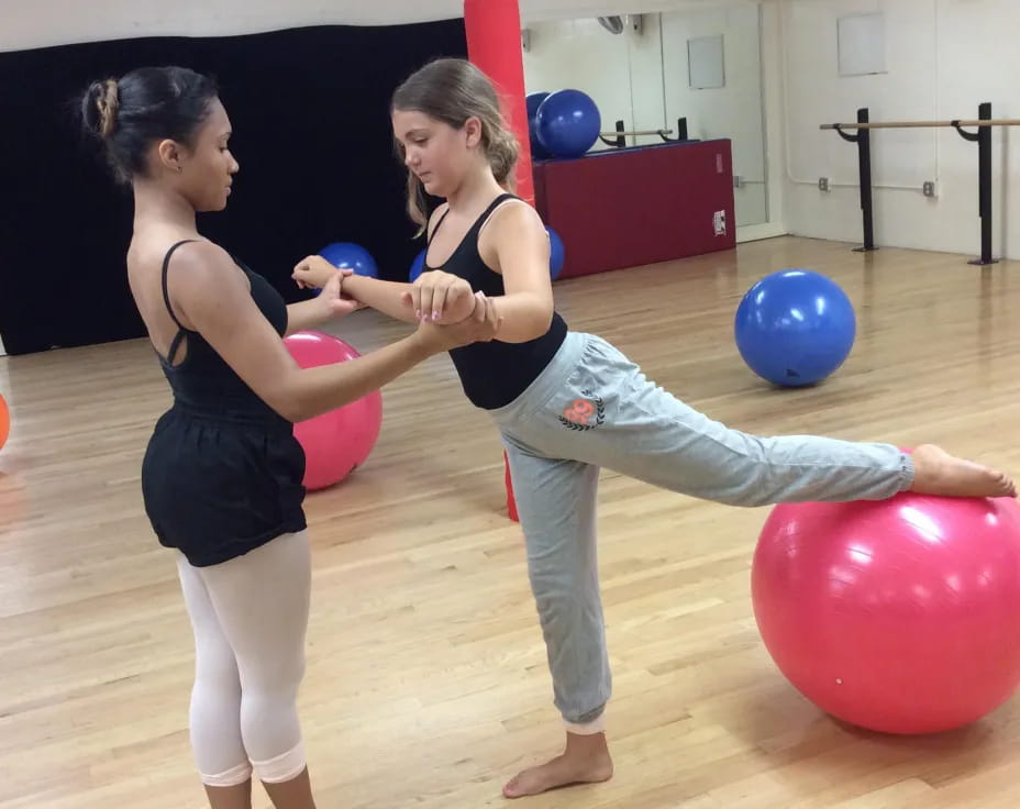 a couple of women exercising