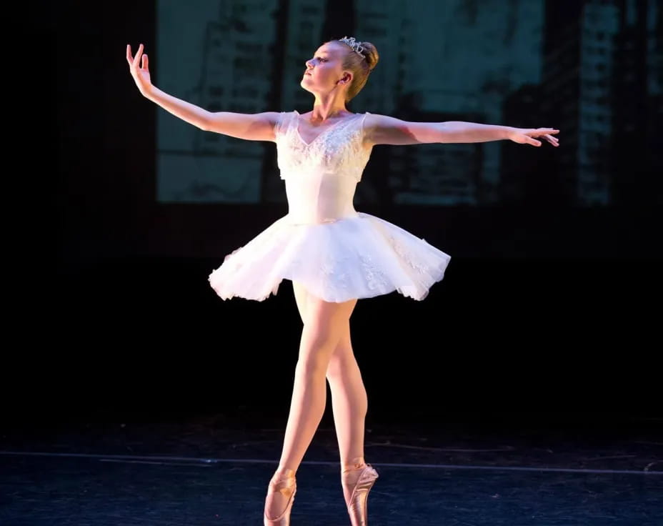 a woman dancing on a stage