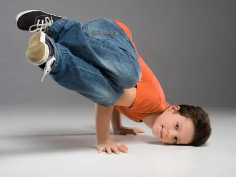 a boy doing a handstand