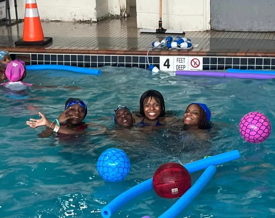 a group of people in a pool