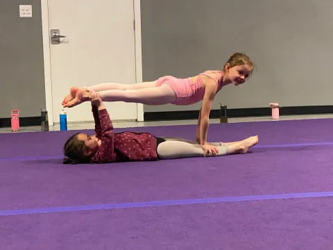 a couple of women doing yoga