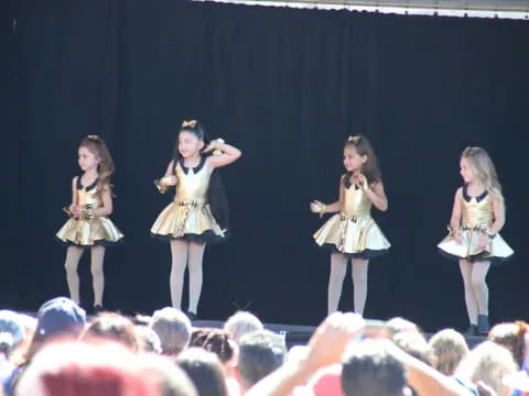 a group of women on a stage