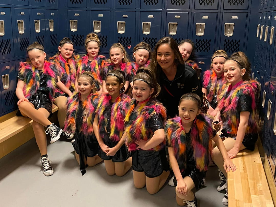 a group of women in a locker room