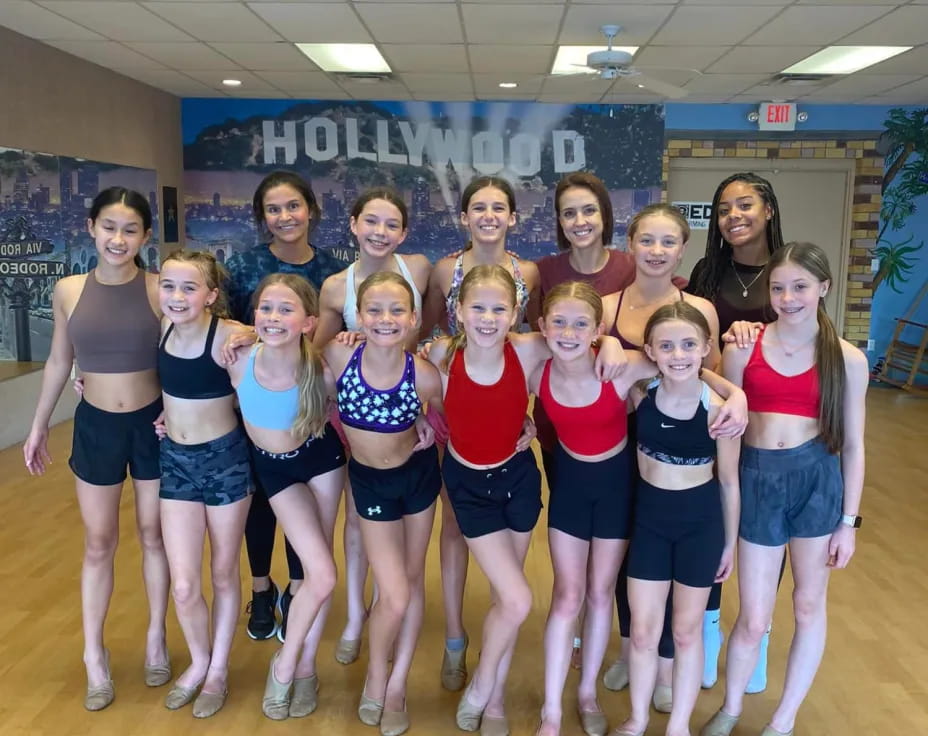 a group of women in athletic wear
