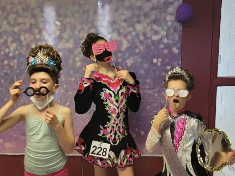 a group of kids wearing clothing