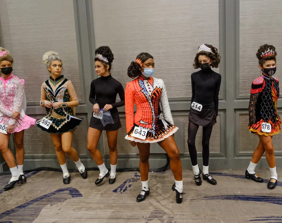 a group of women wearing clothing