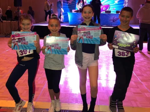 a group of girls holding signs