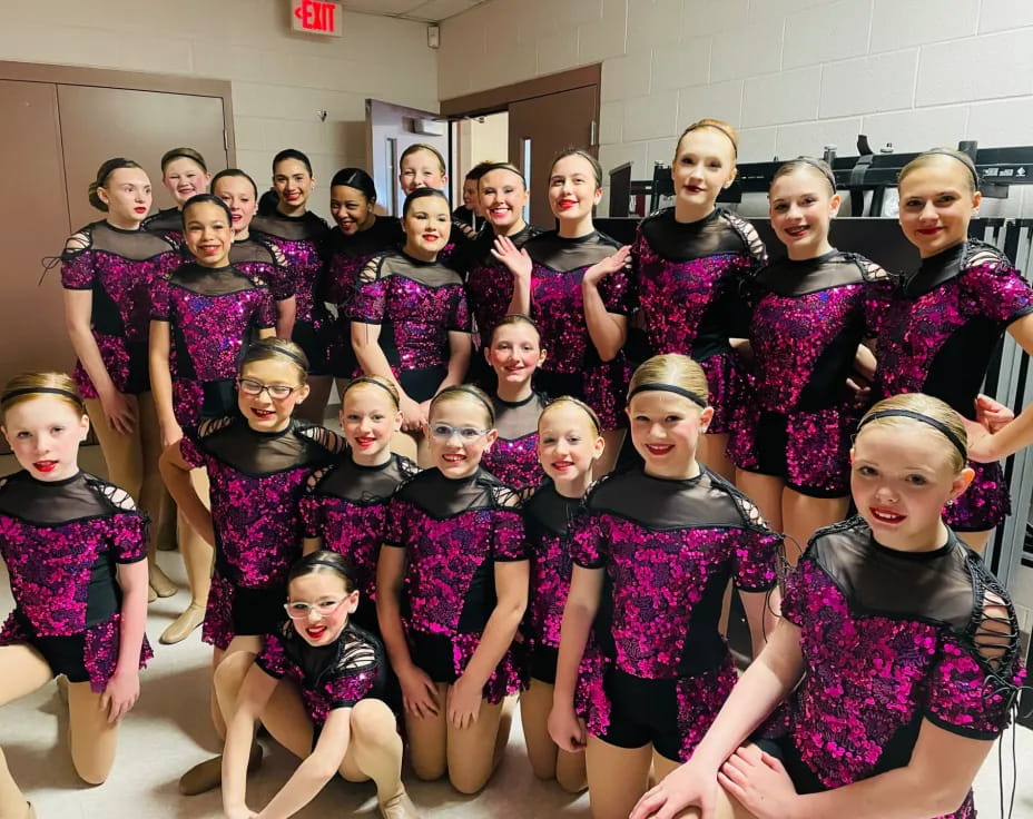 a group of girls posing for a photo