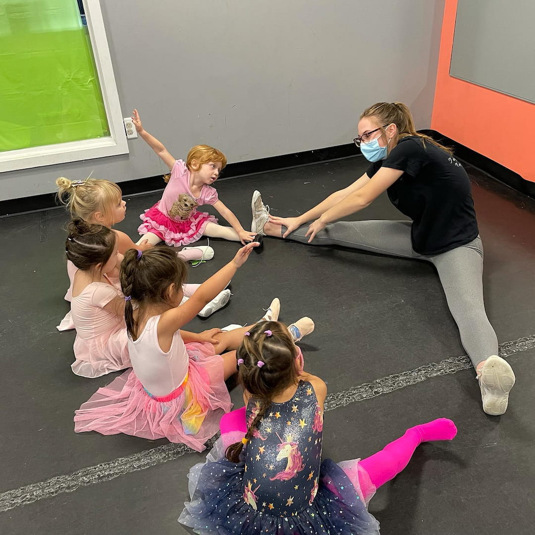 a person teaching a group of children