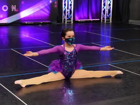 a person in a tutu on a stage