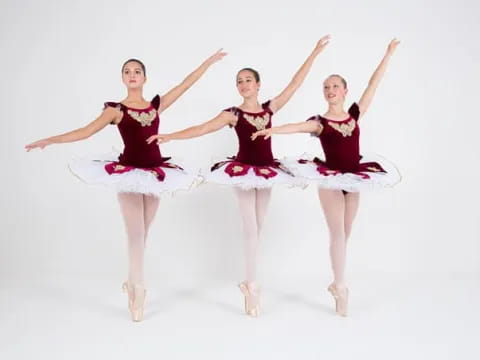 a group of women in dresses