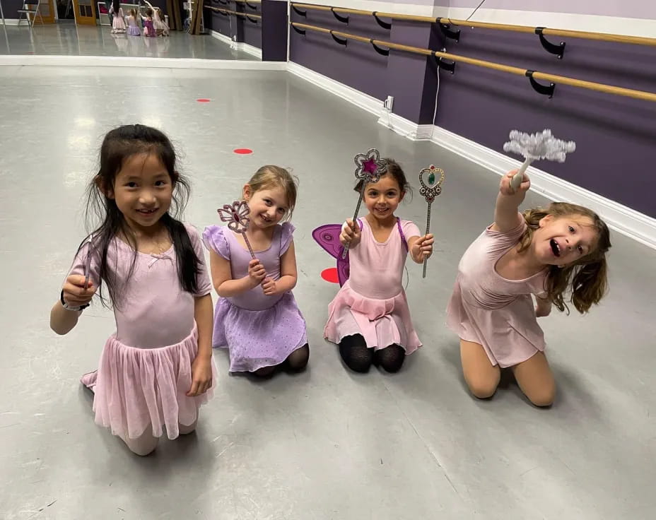 a group of girls in dresses