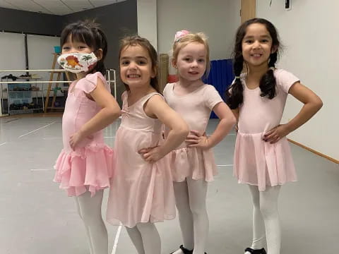 a group of girls in dresses
