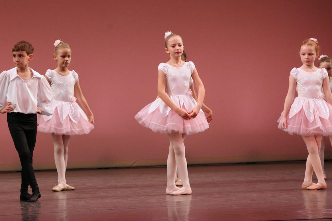 a group of children in dresses