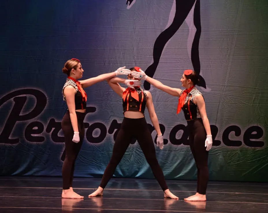 a group of women dancing on a stage