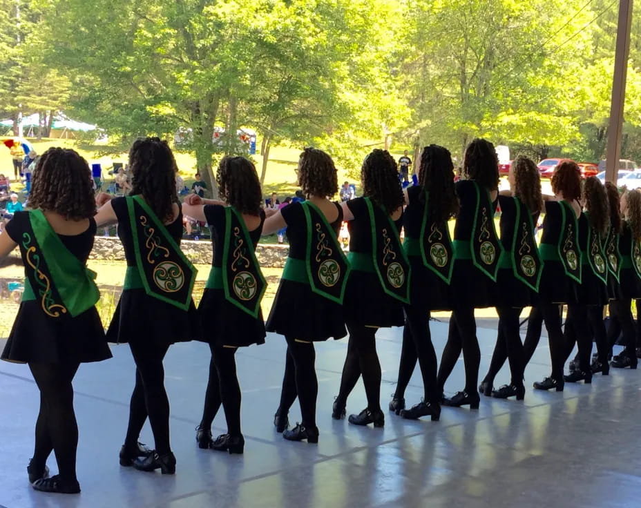 a group of people in green uniforms