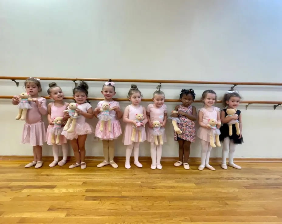 a group of girls in dresses