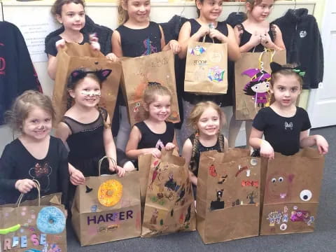 a group of kids holding boxes