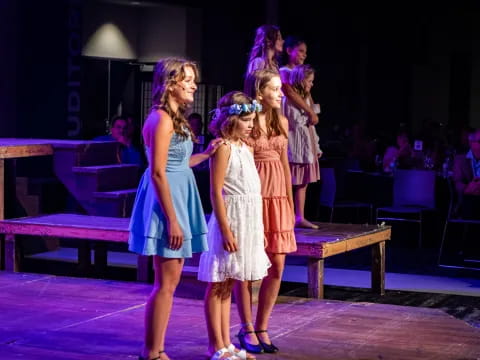 a group of women on a stage
