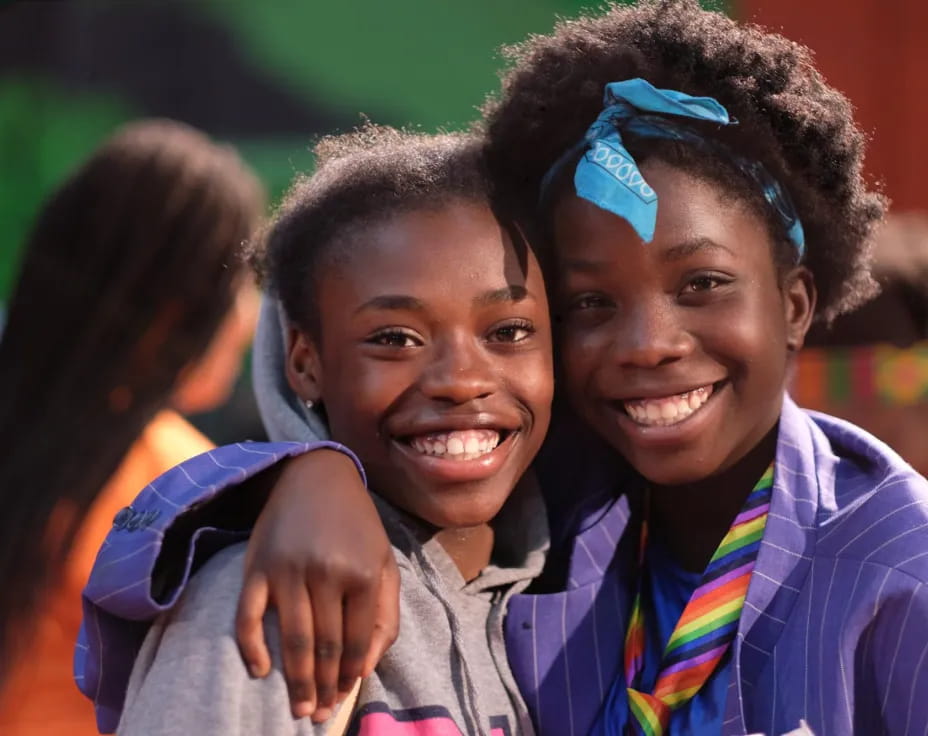a couple of children smiling