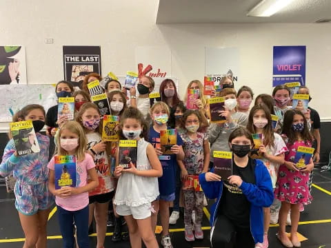 a group of children wearing masks