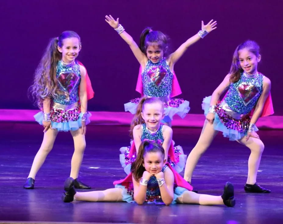 a group of girls on a stage