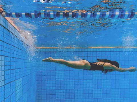 a person swimming in a pool