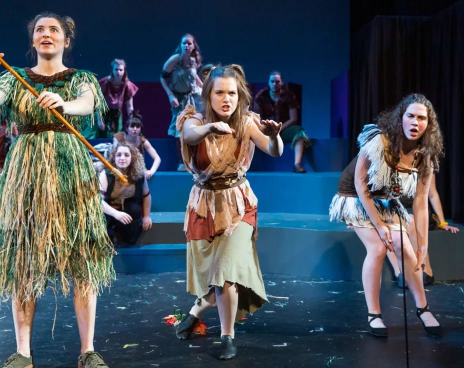 a group of women dancing on a stage