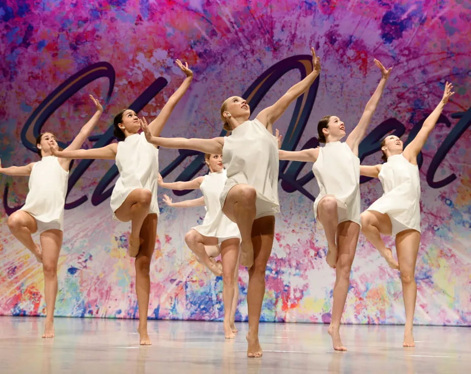 a group of women dancing on a stage