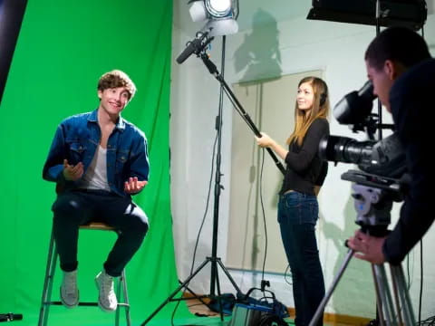 a man and a woman with cameras
