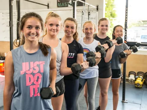 a group of women holding guns
