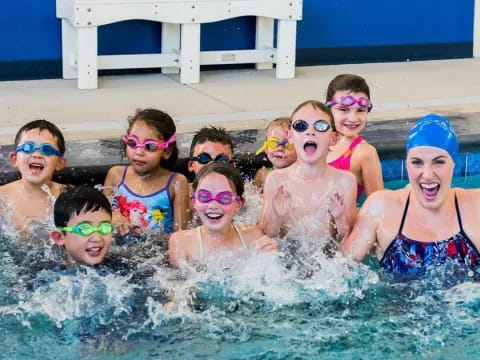a group of kids in a pool