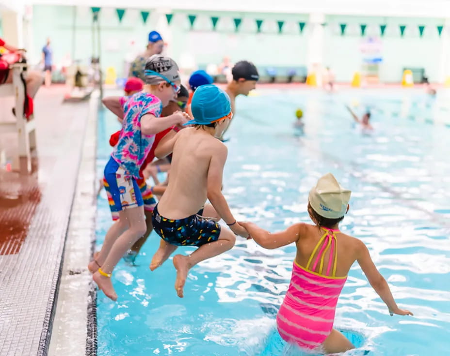a group of people in a pool