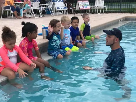 a group of children in a pool