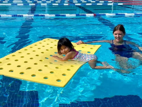 a couple of people in a pool